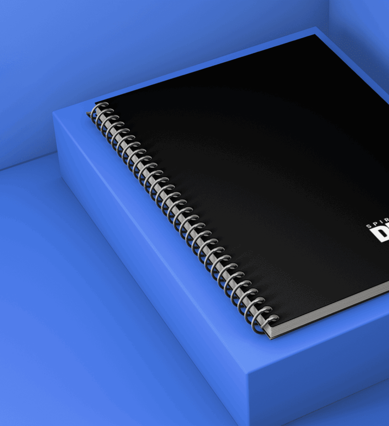 mockup-of-a-spiral-notebook-on-a-small-pedestal-1005-el.png